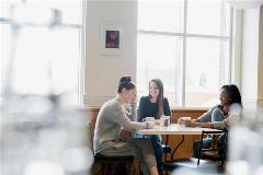stock-photo-friends-enjoying-coffee-at-cafe-table-105061859