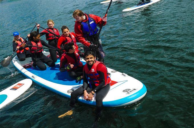 DBS students paddle boarding DBS students paddle boarding