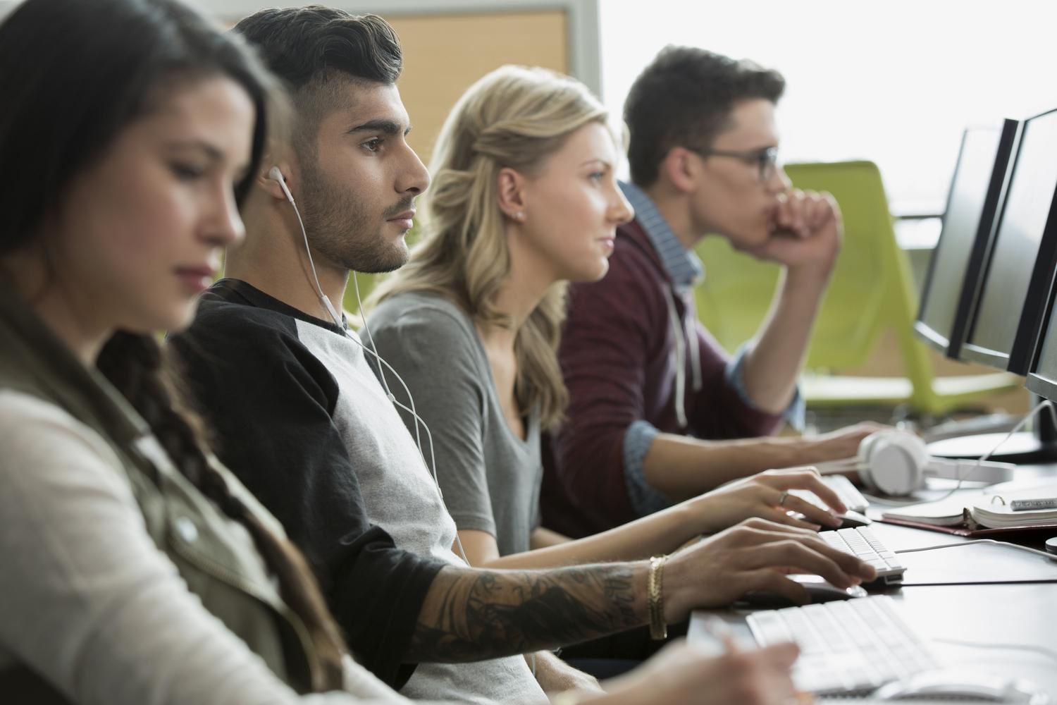 stock-photo-college-students-working-in-computer-lab-82836513