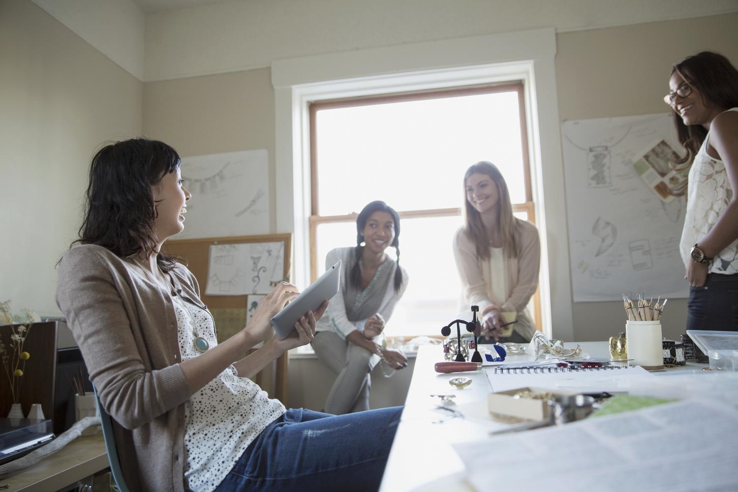 stock-photo-professional-female-jewelry-artists-having-discussion-in-home-office-83062197