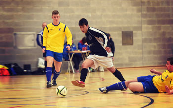 The DBS Student football team playing an indoor match